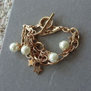 NRO gold tone faux pearl & rhinestones stars charm bracelet